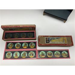 Tinplate magic lantern with two boxes of slides 'magic lantern slides Bilder zu lantern magica vues sur verre four lanternes magiques series 1 and 2' 