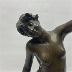 Bronzed semi nude female figure with one hand raised, upon a marble plinth, H43cm  