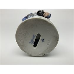 Meissen blue and white figure, modelled as a gentleman holding a hat of flowers, raised upon Greek key design base, with blue crossed swords and impressed C 73 and 149 marks beneath, H18cm