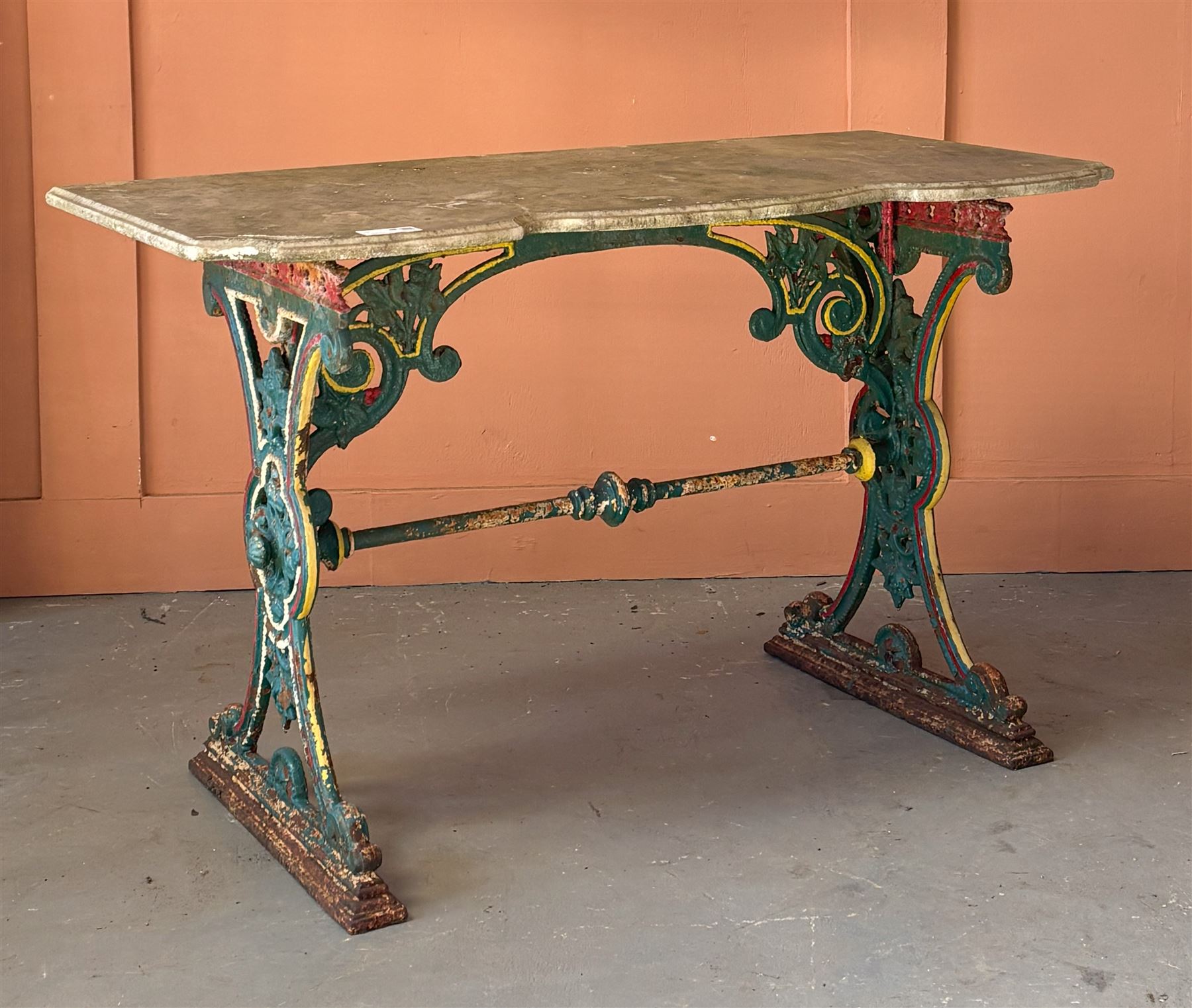 Victorian cast iron conservatory table, the serpentine moulded white marble top raised on a polychrome painted base well detailed with scrolls and floral motifs. H76cm, W123cm, D56cm. - COLLECTION BY APPOINTMENT FROM: The White House, Thirsk Road, Easingwold, York, YO61 3NF - CALL 01723 507111 TO ARRANGE