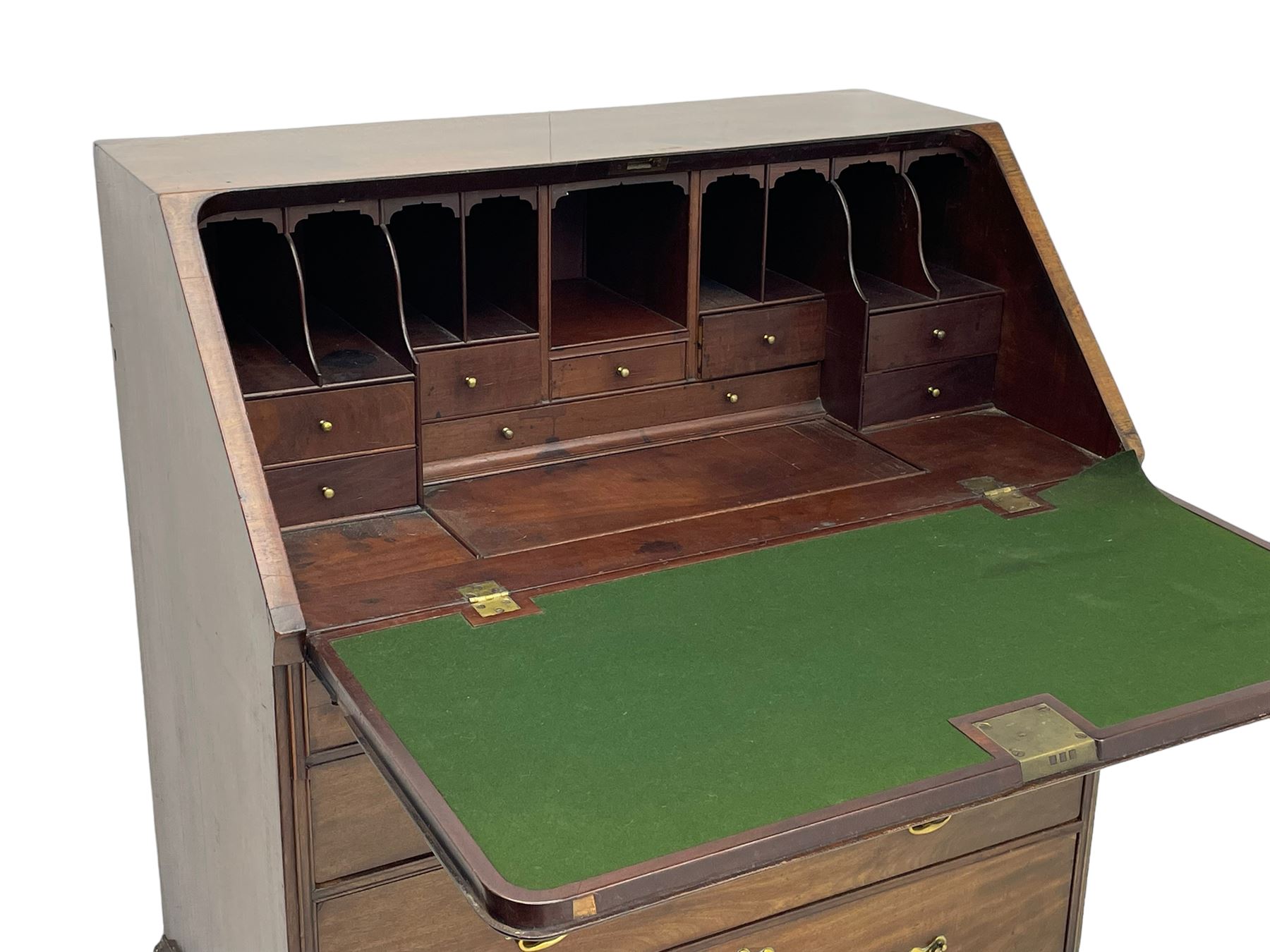 Georgian red walnut and mahogany bureau, moulded rectangular fall front with rounded upper corners, the interior fitted with sliding storage well, a combination of small drawers and pigeons holes, two short and two long drawers below, on bracket feet