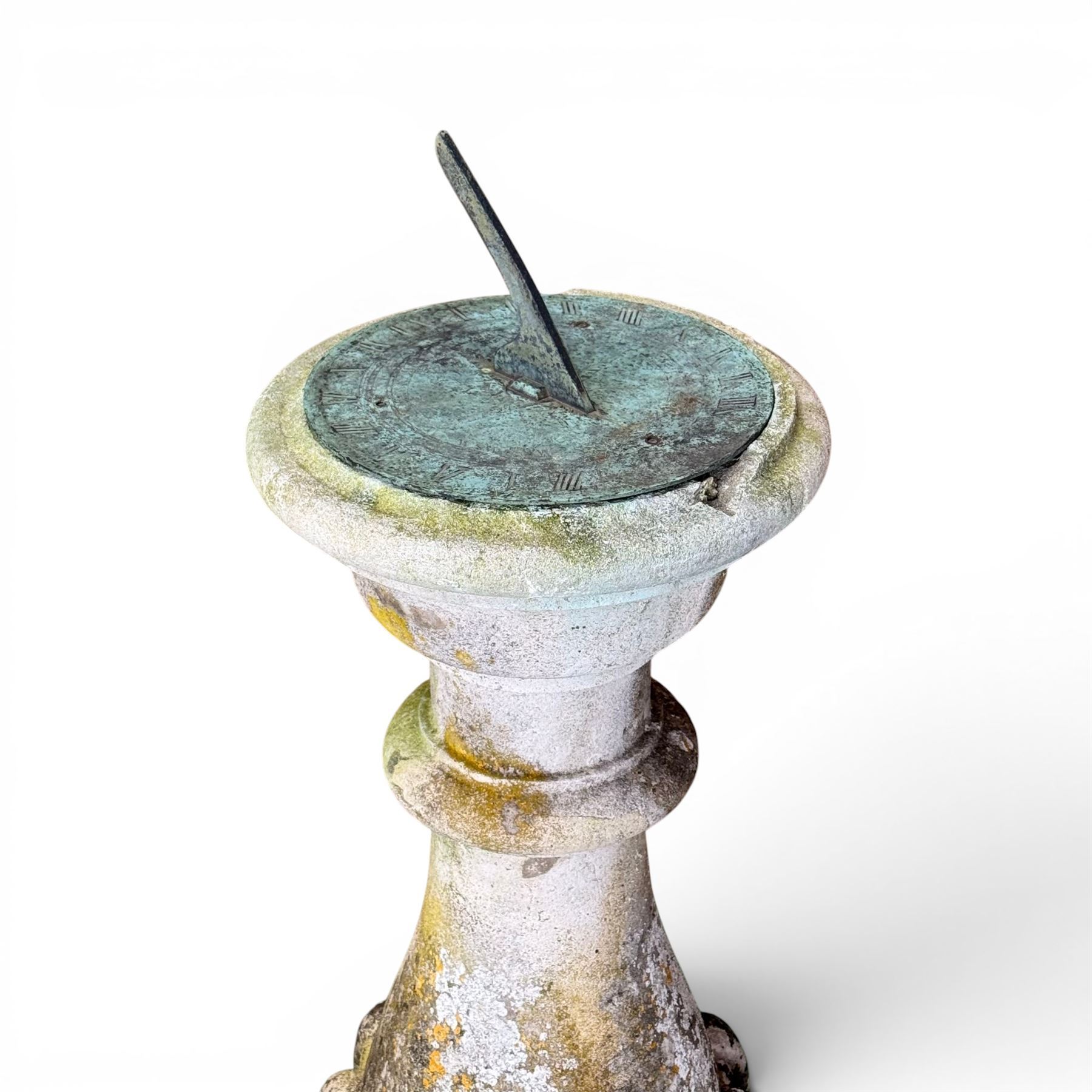 Large weathered cast stone sundial, raised on circular column of bulbous form, square plinth base