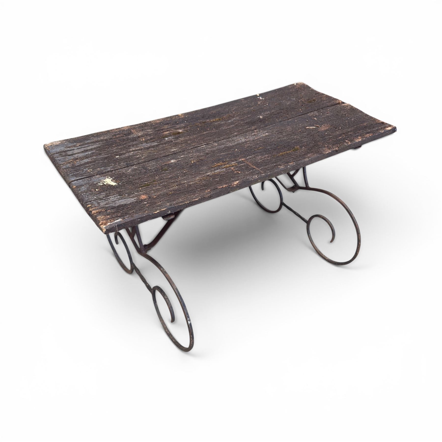 Cast iron garden table, with rectangular weathered slatted wooden top, raised on iron strapwork supports of scrolling form, in black painted antique finish 