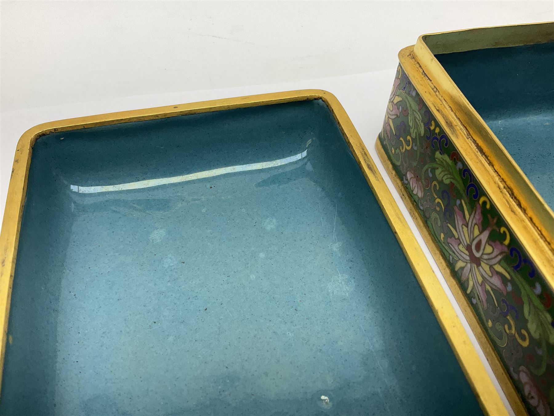 20th century Chinese cloisonne enamel smoking set, comprising two ashtrays, box and tray, with floral and foliate scrolling on green ground