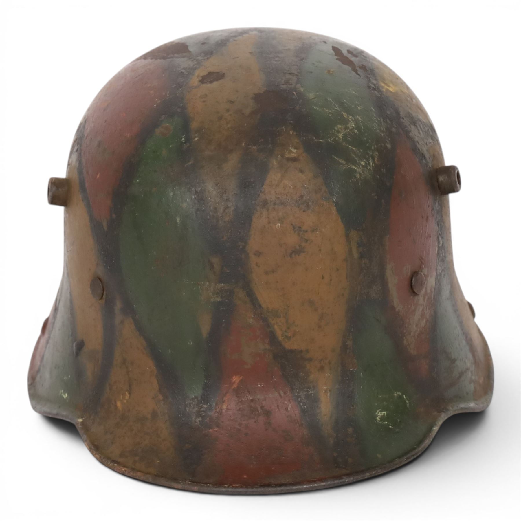 WWI German camouflage M16 helmet, with diamond camouflage painted finish to the skull in green, brown and ochre colours with black separation lines, the interior with leather band which supports three pad leather lining