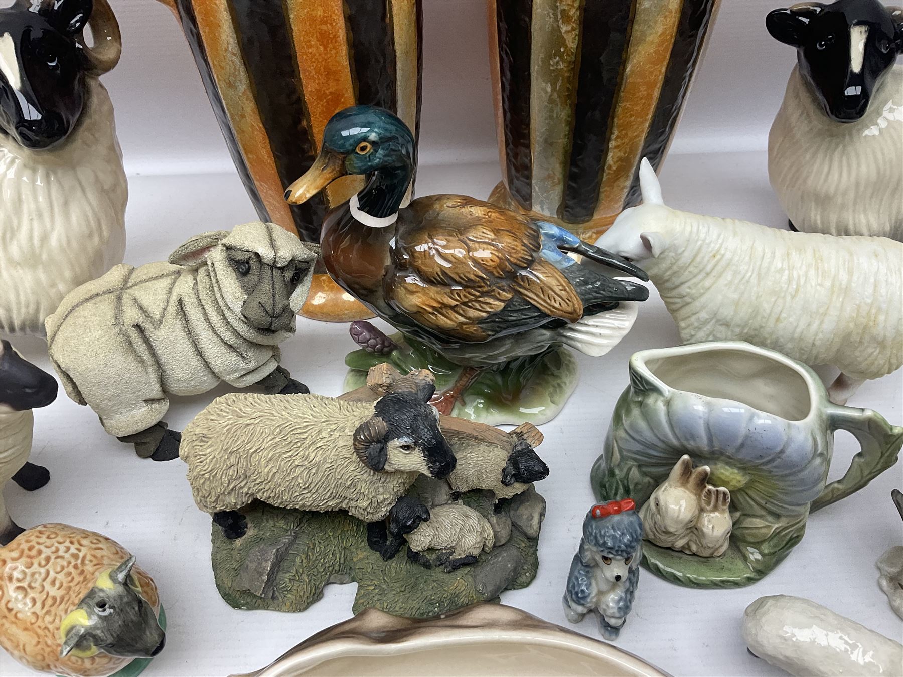 Two Hornsea Fauna vases, together with a similar jug, Coopercraft sheep and other collectables  