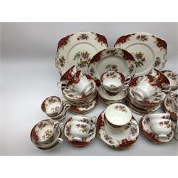 Paragon Rockingham pattern tea wares, comprising seven breakfast cups, seven tea cups, nine coffee cups, sixteen saucers, and twelve smaller saucers, two open sucriers, one plate, two cake plates, and fifteen side plates. 