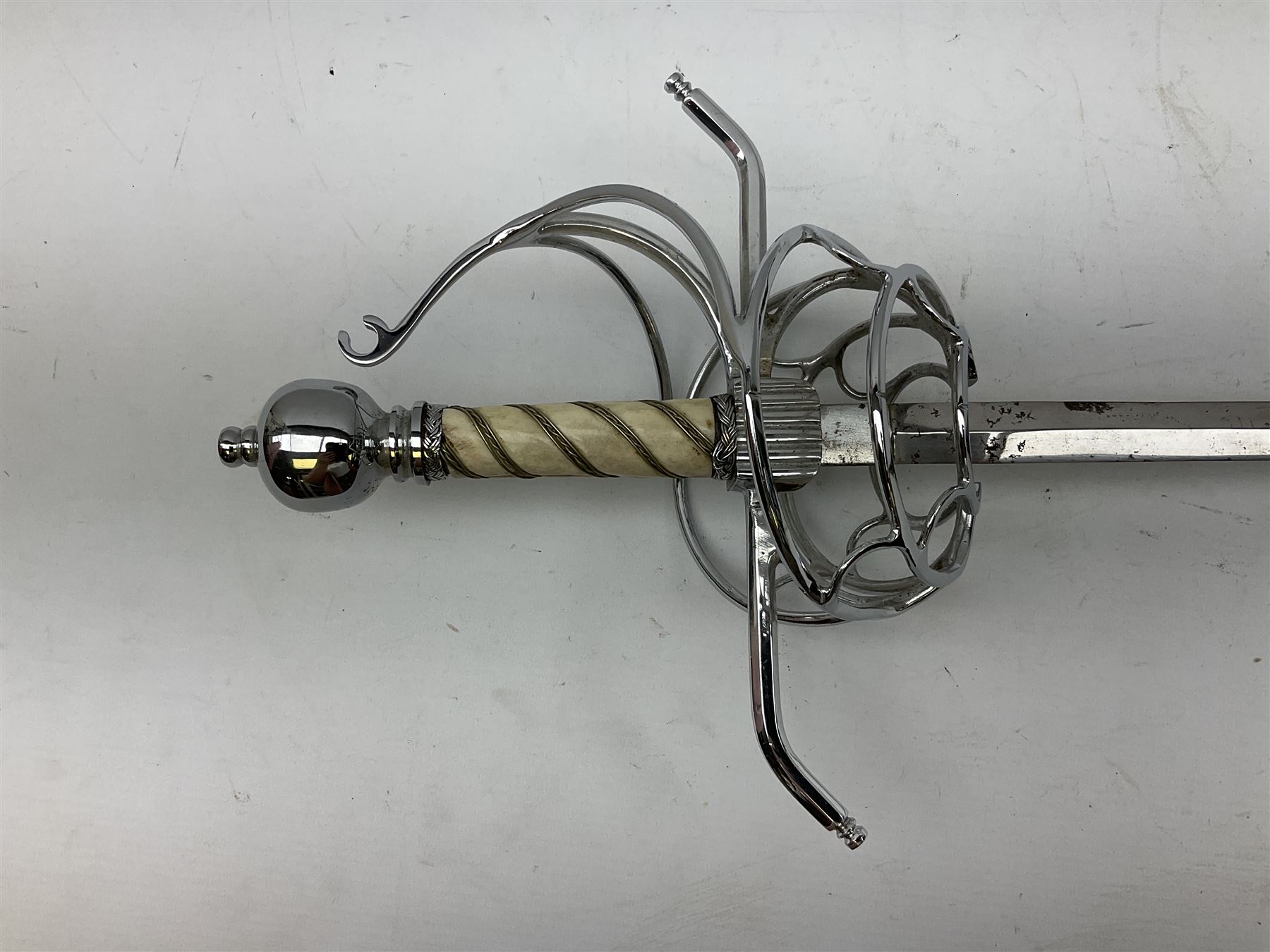 Replica knight's longsword, the 91.5cm double-edged steel blade with basket hilt and wire-bound bone grip with spherical pommel, in leather scabbard L112cm overall