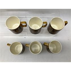 Collection of 1970s Hornsea mugs designed by John Clappison, comprising six Train Robber pattern examples together with owl patterned example on dark teal ground, and further example decorated with stylised hen and chick and egg, approx 9cm, together with four small cup bowls, all with stamped Hornsea marks beneath