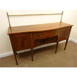  Edwardian inlaid mahogany serpentine front sideboard with brass rail, single drawer above tambour slide flanked by two cupboard doors, square tapering supports on spade feet, W183cm, H135cm, D61cm  