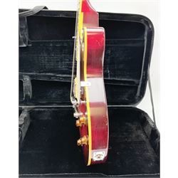 1980s Les Paul Epiphone limited edition cut-away electric guitar by Gibson, the burgundy coloured body with two pick-ups, volume and tone knobs and scratch plate, original tuning pegs, serial no.U6030215, 101cm overall; in modern Kinsman fitted carrying case