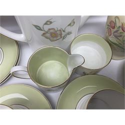 Susie Cooper Dresden Sprays pattern breakfast set, including coffee pot, sugar bowl, milk jug, egg cup, teacup trio and bowl, together with a Susie Cooper Wild Rose pattern coffee service for six