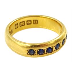 22ct gold rubover set seven stone sapphire half eternity ring, Birmingham 1919