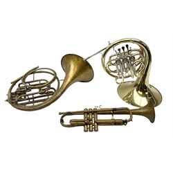 French horn marked 'hornblower 161' and another similar example, together with a trumpet