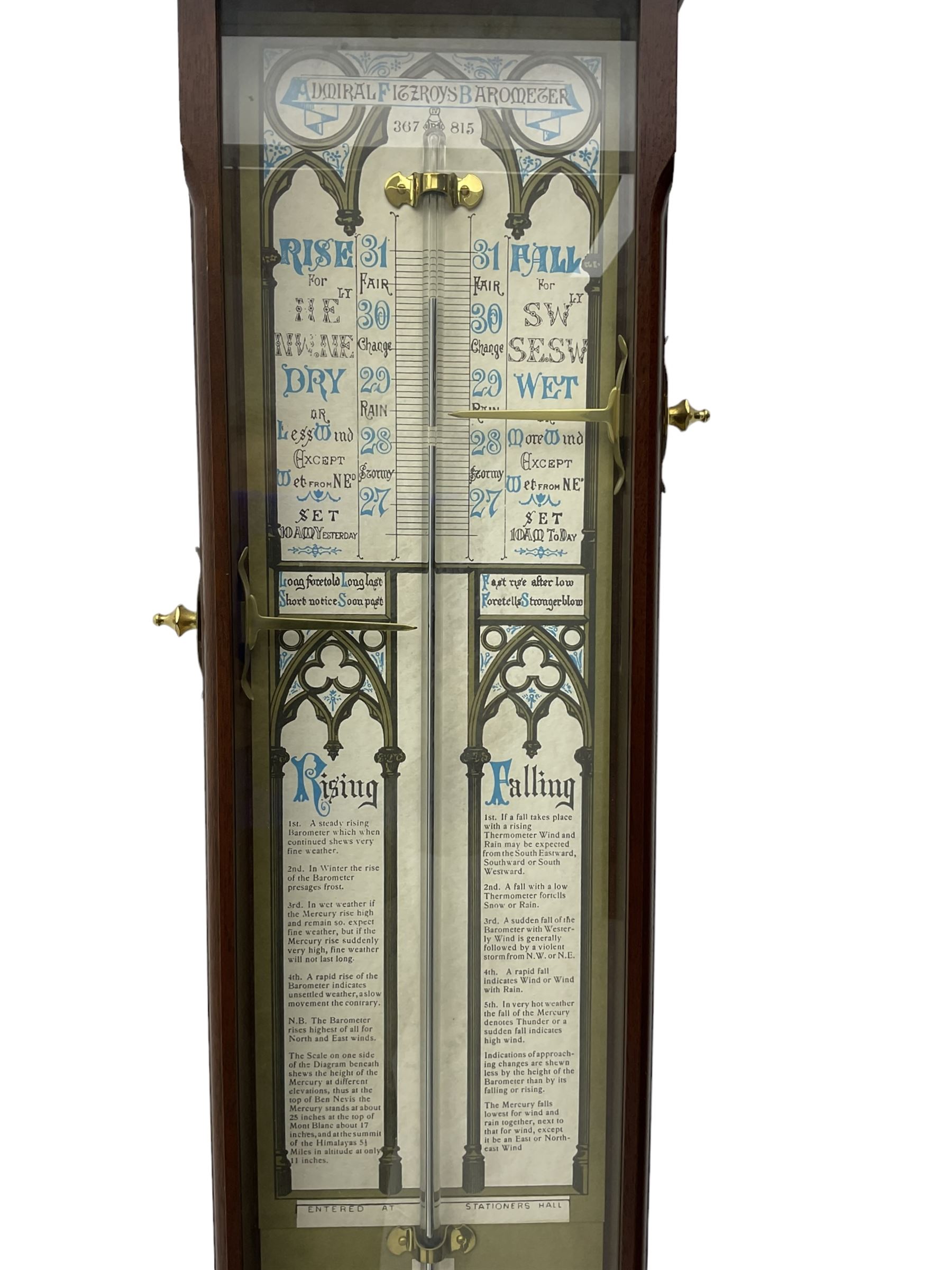 Comitti of London - 20th-century replica mahogany Fitzroy barometer, in a fully glazed case with full-sized Fitzroy charts and weather predictions, with two adjustable recording pointers, spirit thermometer and storm glass, barometric pressure recorded in inches, cistern tube in good condition and containing mercury.