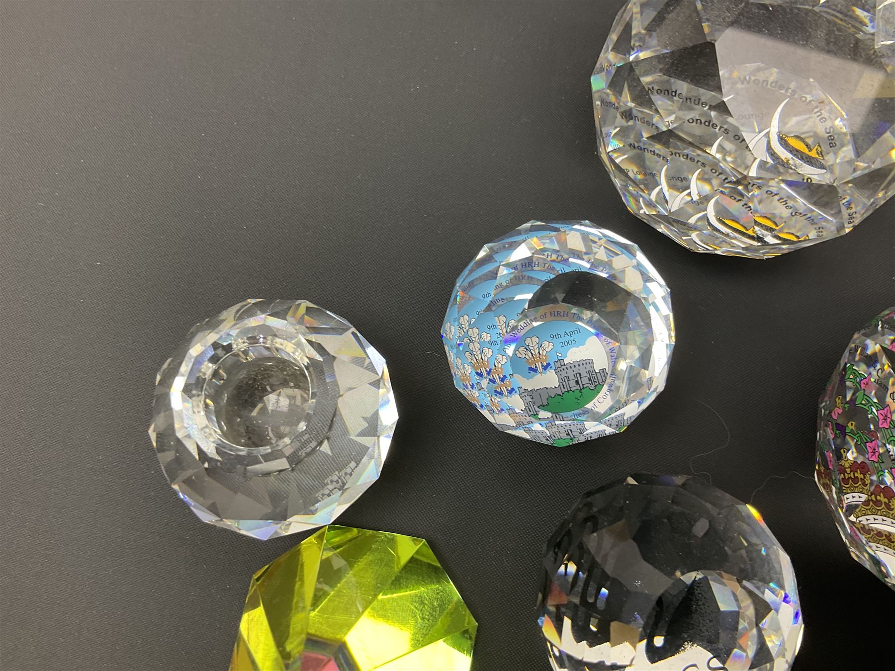Swarovski Crystal paperweights, to include a globe with dove to the top, pyramid shapes etc, together with a large collection of boxes and stands  