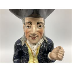 Early 20th century Staffordshire William Kent Squire toby jug, modelled seated upon a corner chair holding a jug of ale in his right hand, H28cm