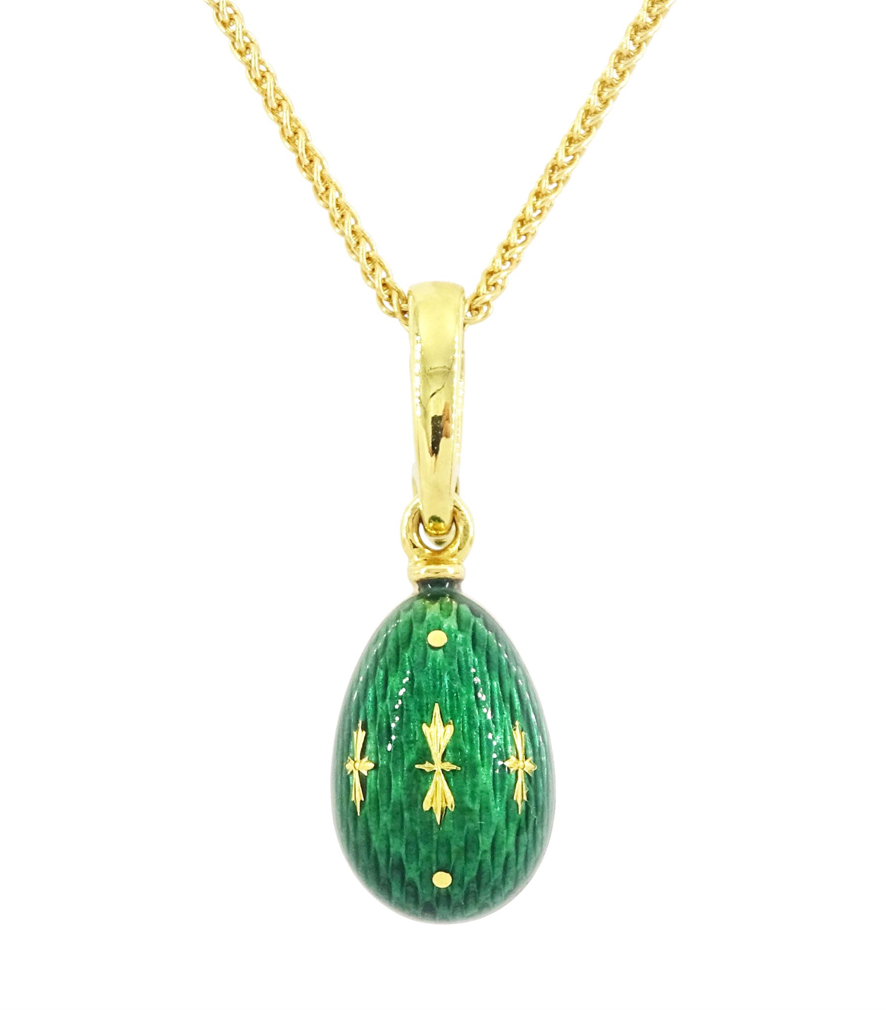 Fabergé 18ct gold enamel egg pendant, Ref. F-1310, green guilloche enamel egg, with hinged bail, designed by Victor Mayer for Fabergé, on 18ct gold wheat chain necklace, boxed with papers