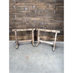 Pair of late 19th century pitch pine trestles, square tapering form in stripped finish