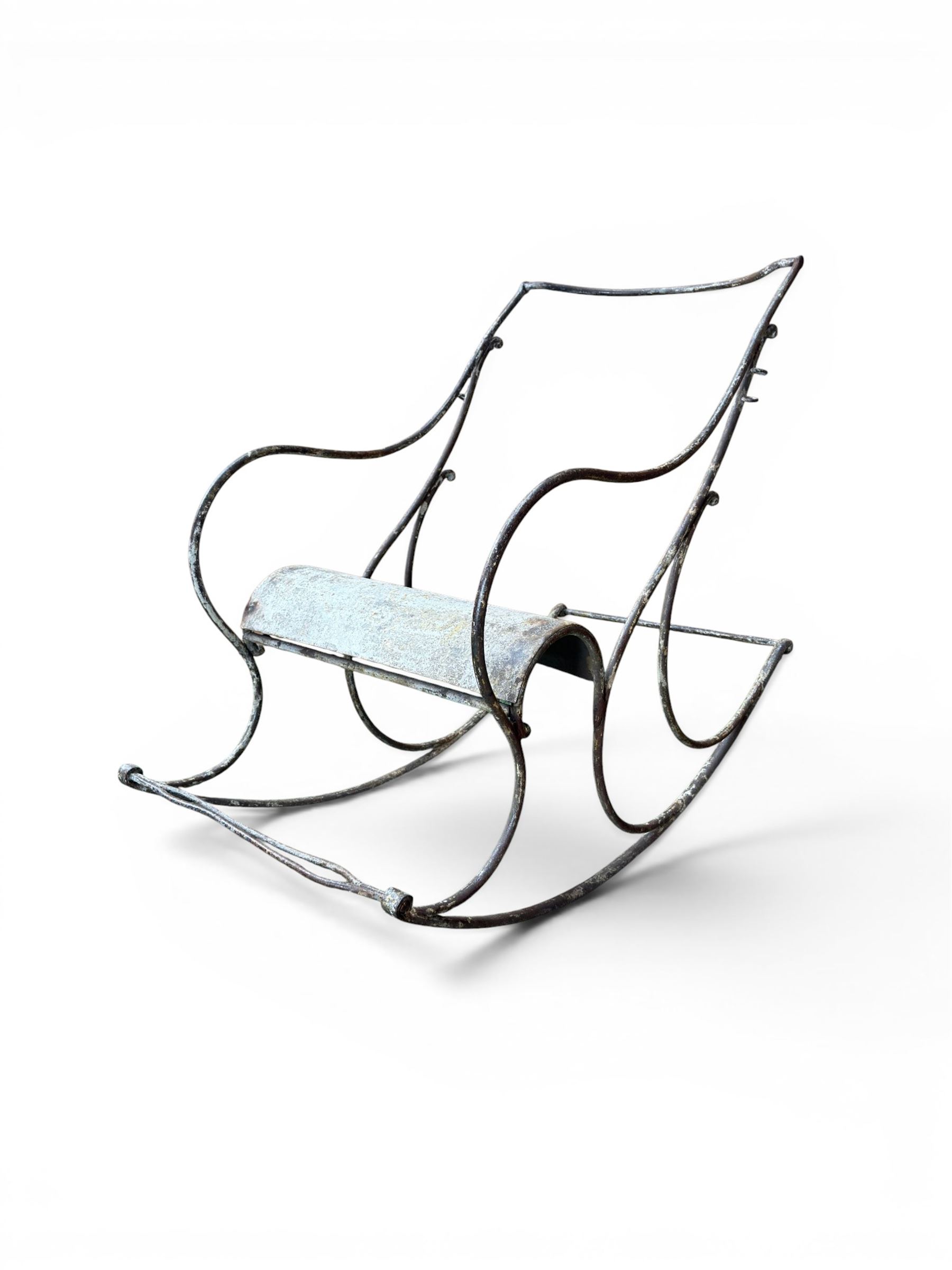 Pair of large unusual 19th century wrought iron garden rocking chairs, simple scroll design, lacking canvas seat