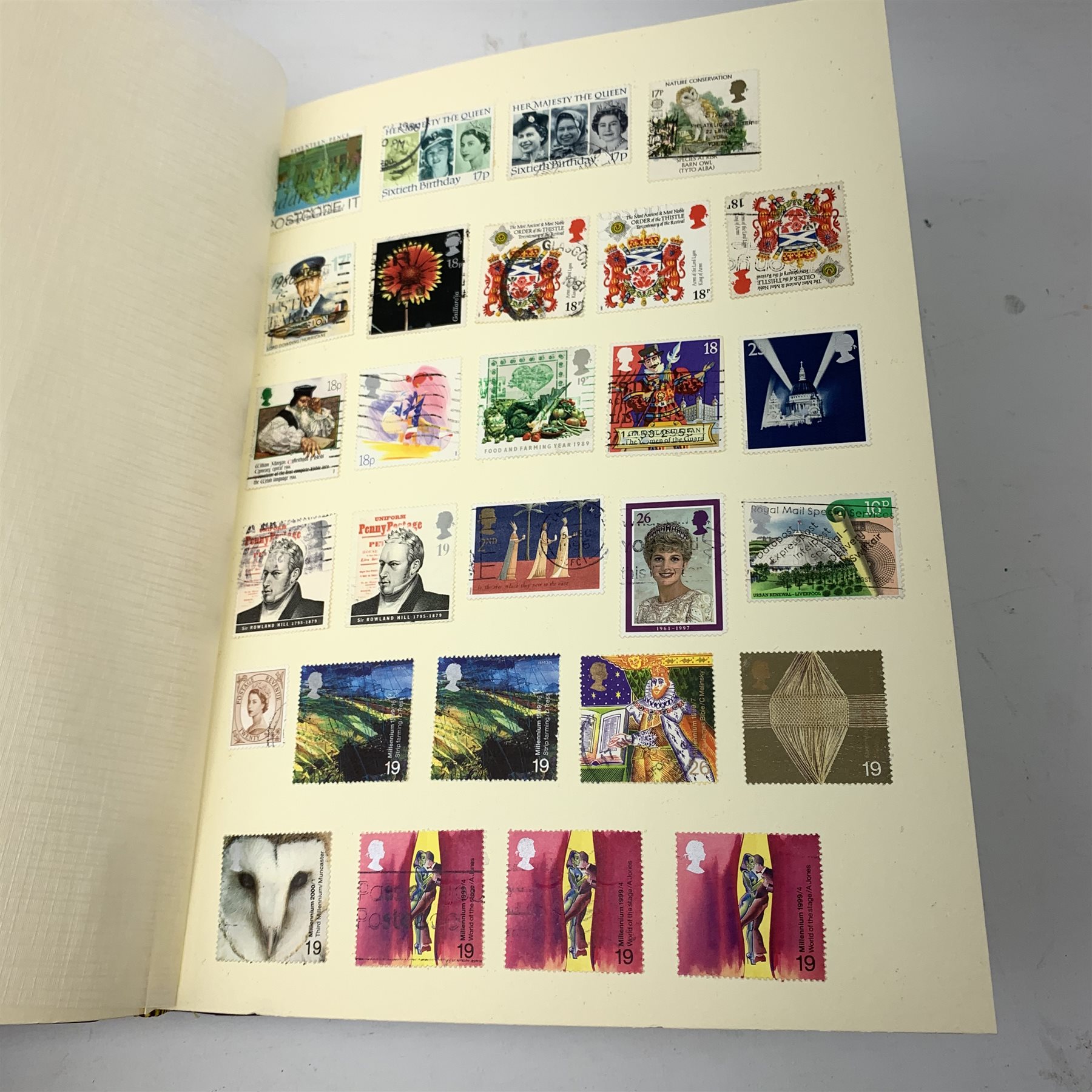Two albums of world stamps, comprising The Cardinal Stamp Album, together with a further larger album, each containing Queen Victoria stamps.