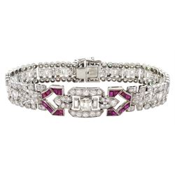 Art Deco platinum diamond and ruby bracelet, circa 1920-1930, the central panel set with a single emerald cut diamond of approx 0.55 carat, flanked by two baguette cut diamonds and old cut diamond surround, the articulated geometric design bracelet with vari-cut rubies, round and baguette cut diamonds, total diamond weight approx 7.00 carat, in Mappin & Webb silk and velvet lined box