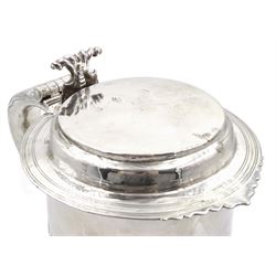 Queen Anne silver tankard, of plain tapering cylindrical form, with stepped and flat-domed cover, twit cast thumbpiece and curved handle, the body engraved with eagle crest, hallmarked Abraham Barachin, Hull, circa 1706, the body and cover stamped once with makers mark and twice with town mark, H18cm, approximate weight 21.46 ozt (667.7 grams)
