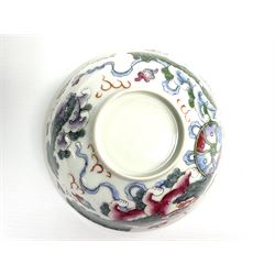 18th century Chinese blue and white bowl painted with a continuous scene of figures in a river landscape, with Artemisia leaf mark beneath, D13cm, together with a Chinese porcelain bowl enamelled with Buddhist lions with brocade balls and ribbons, surrounded by scrolling clouds and flames, unmarked, D14cm, (2)