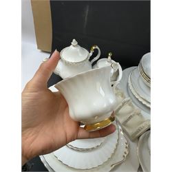 Royal Albert Val D'or part tea and dinner service, including two coffee pots, two teapots, milk jug, covered sucrier etc together with matching items 