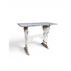 Victorian cast iron garden table, rectangular slate top raised on pierced scrolling foliate end supports with urn and column designs, united by a spindle support stretcher with scrolling acanthus spandrels, stamped 'Registered Design' with indistinct number, in distressed white painted finish