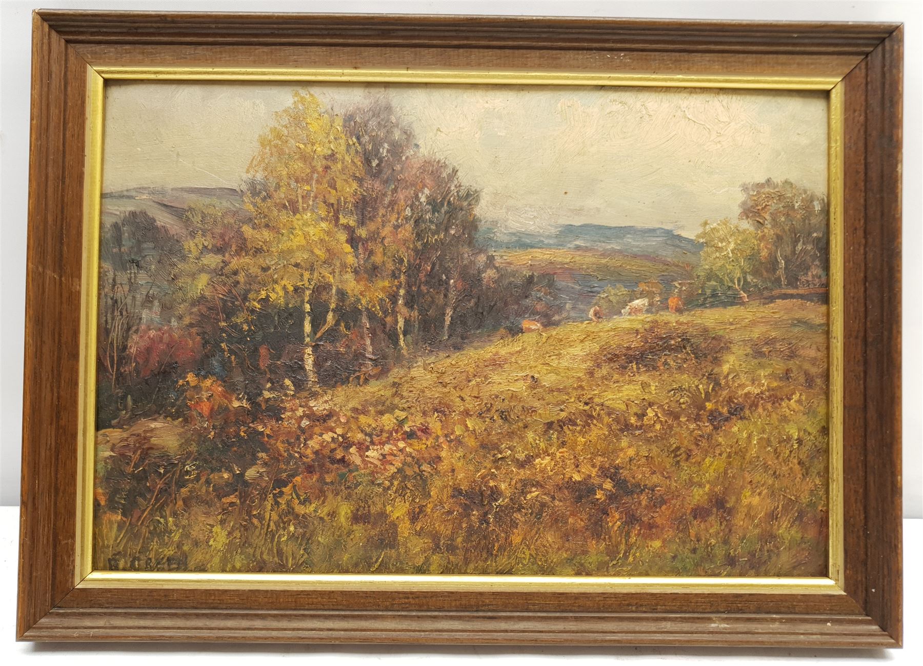Reginald Green (British 1884-1971): Cattle Grazing on a Wooded Hillside, oil on board signed 22cm x 32cm
