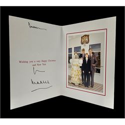 1997 Royal Christmas card with gilt embossed Prince of Wales crest to cover, the interior with colour photograph of a smiling Prince Charles, now King Charles III, Prince William and Prince Harry, aboard the Royal Yacht Britannia, signed in autopen 'from Charles' with indistinct name to top