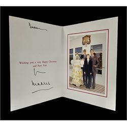  1997 Royal Christmas card with gilt embossed Prince of Wales crest to cover, the interior with colour photograph of a smiling Prince Charles, now King Charles III, Prince William and Prince Harry, aboard the Royal Yacht Britannia, signed in autopen 'from Charles' with indistinct name to top