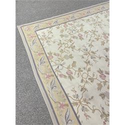 French style Aubusson rug, the pale ground field decorated with interlacing foliage and flower heads, repeating border 