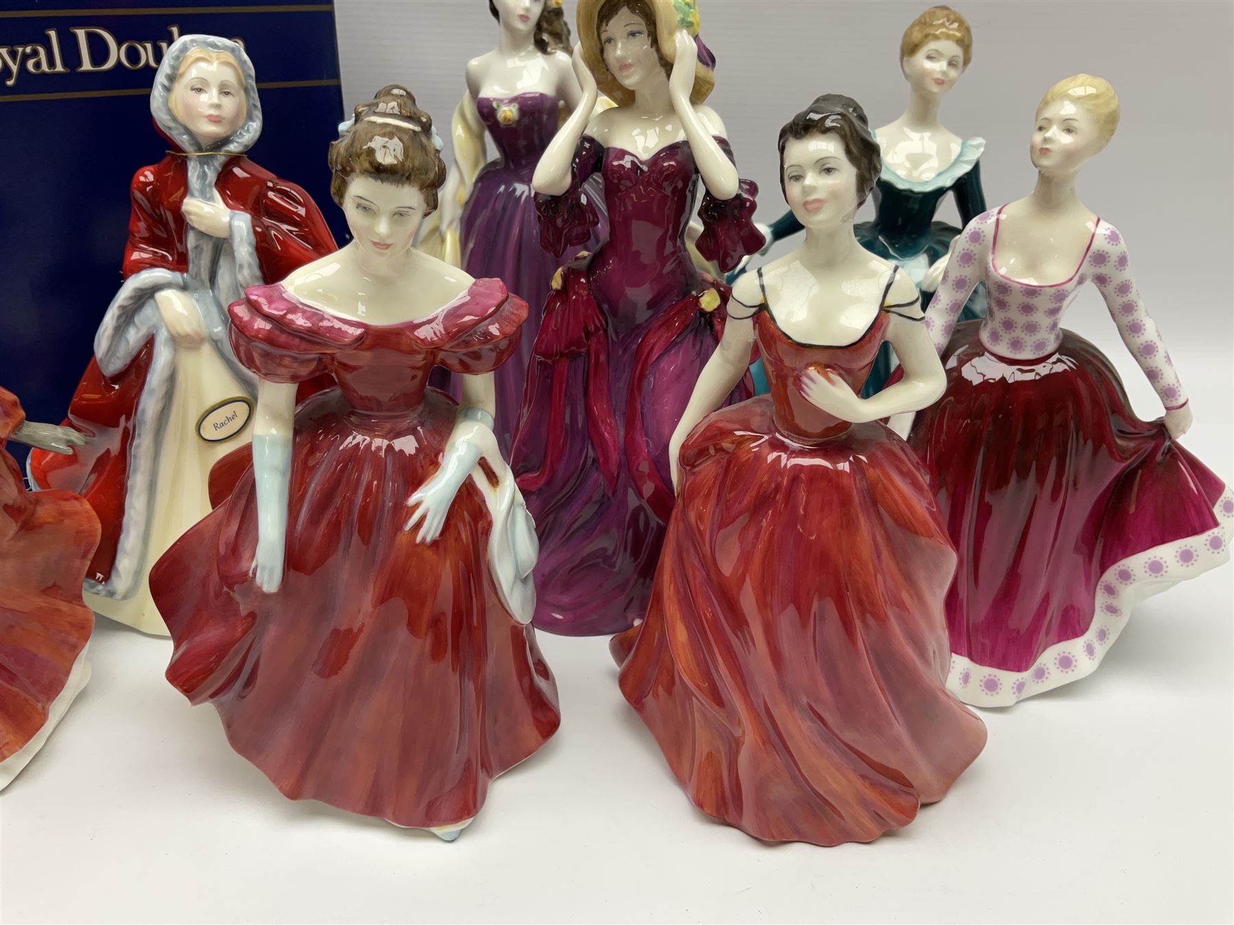 Eight Royal Doulton figures, comprising Rachel HN2936, The Skater HN3439, Janine HN2461, Innocence HN2842, Special Celebration HN4234, Autumn HN4272, Fiona HN2694 and Winsome HN2220, together with three smaller Royal Doulton figures My First Figurine HN3424, Buttercup HN3268 and Autumn Breezes HN2176