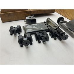 A lathe cross slide, lathe collets and collet holder, clock dial gauge, milling spindle for fly and multitooth cutters, with some commercial clock wheel cutters.