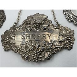 Five modern silver decanter labels, to include three similar Sherry and Brandy examples embossed with scrolls, two hallmarked C Robathan & Son, Birmingham 1989, and one hallmarked Laurence R Watson & Co, Birmingham 1987, together with a scotch example, hallmarked A Marston & Co, Birmingham 1970, and a larger sherry example, embossed with fruiting vines, hallmarked A Marston & Co, Birmingham 1993