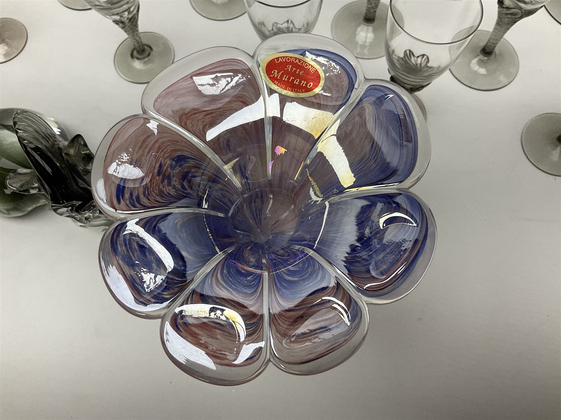Murano glass figure of a recumbent horse, Murano Lavorazione purple and pink flower, and quantity of matching drinking glasses