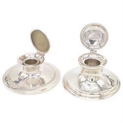 Two early 20th century silver mounted capstan inkwells, both of typical form, the first example hallmarked Wilmot Manufacturing Co, Birmingham 1918, the second example hallmarked Spooner Clowes & Co, Birmingham 1908, largest D15cm, H9.5cm