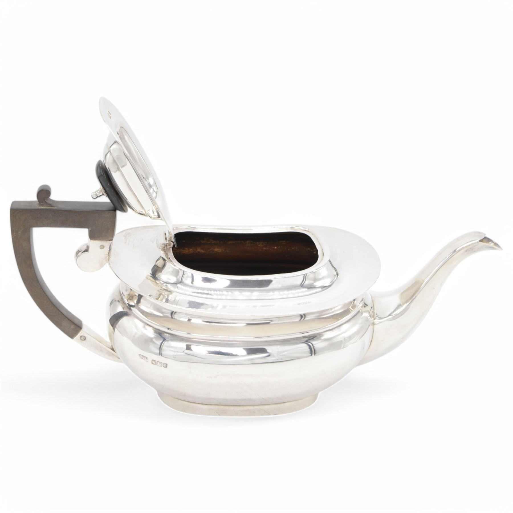 1920s silver tea pot, of oval bellied form, with Bakelite type handle and finial, hallmarked C W Fletcher & Son Ltd, Sheffield 1923, H15cm