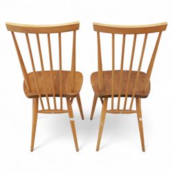 Ercol - Pair of high back Windsor kitchen chairs, elm seats with beech stick backs and legs, shaped saddle seats and turned stretchers