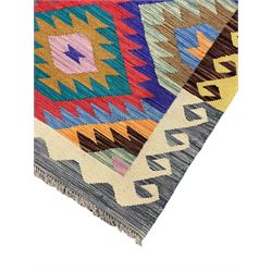 Anatolian Turkish Kilim rug, multi-coloured ground, decorated with geometric stepped lozenges with in a scrolled border