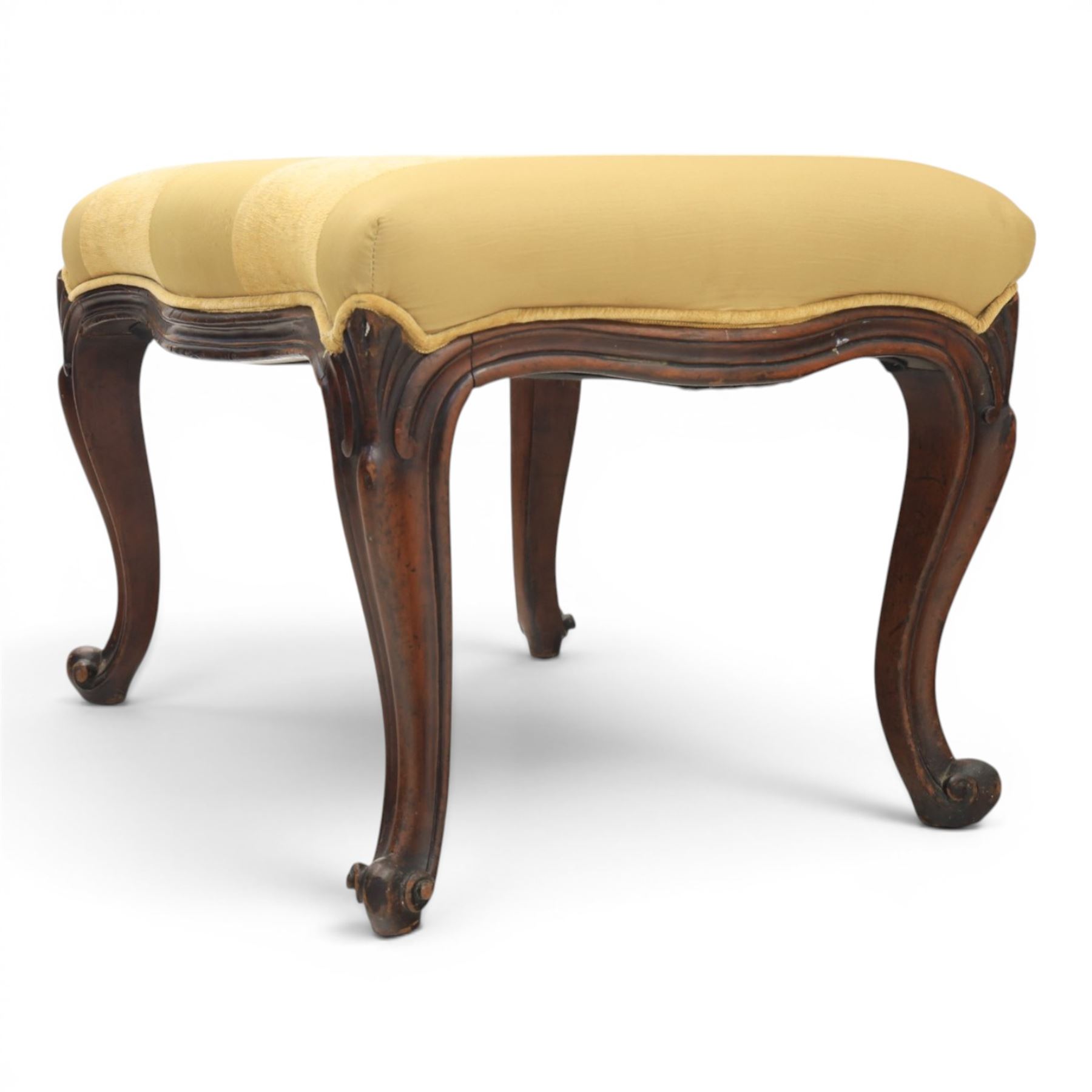 Victorian mahogany Cayley style footstool, serpentine upholstered seat raised on cabriole supports terminating in scroll feet