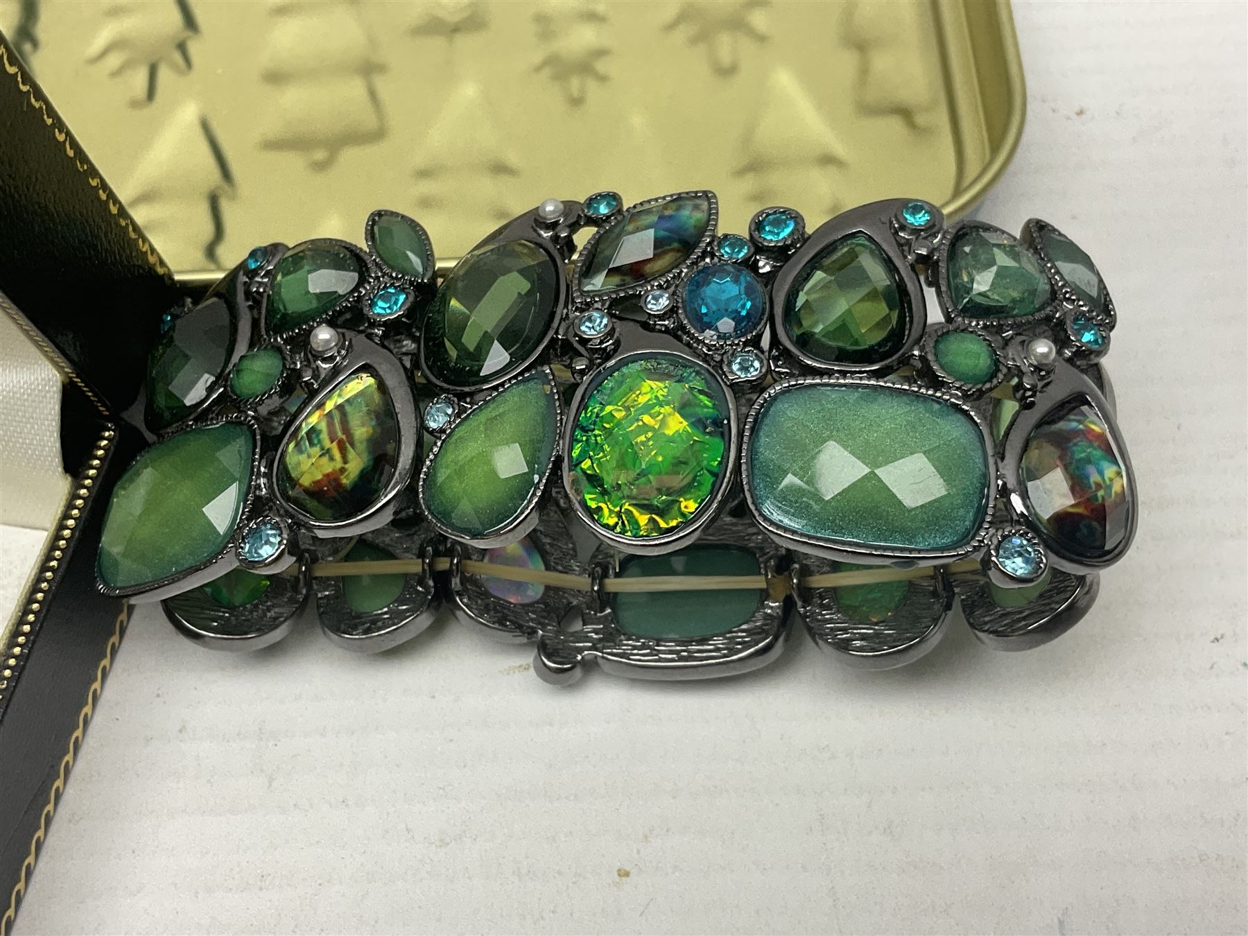 Silver ammonite pendant, silver earrings and a collection of beaded and other costume jewellery