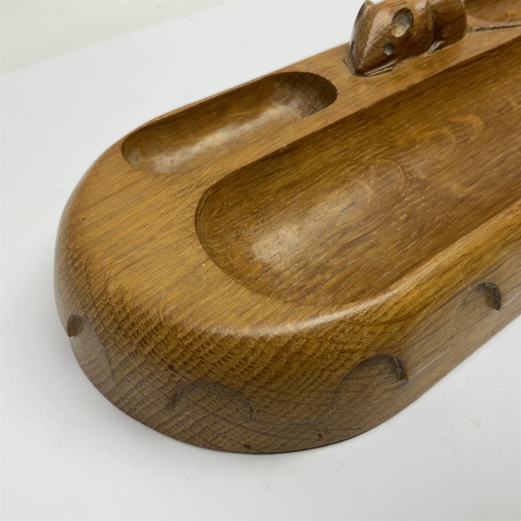 Mouseman - oak pen tray, rectangular form with rounded ends, carved mouse signature over penny moulded edge, by the workshop of Robert Thompson, Kilburn
