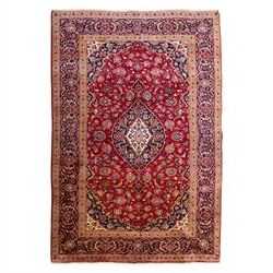 Central Persian Kashan hand-knotted rug, crimson red field with central ivory and indigo f...