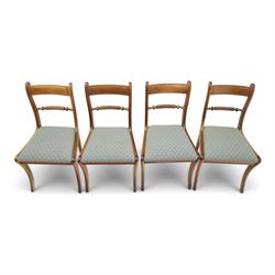 19th century mahogany extending dining table, rectangular top with rounded corners raised on turned and fluted supports with brass cups and castors, with two additional leaves; with set of eight (6+2) Regency design mahogany dining chairs, spiral-reeded back-bar over drop-in seats and sabre supports (W54cm H85cm)