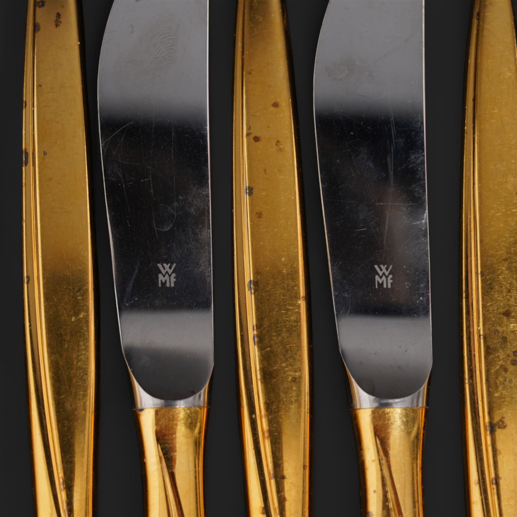 Extensive suite of WMF 800 silver gilt cutlery, for twelve covers, comprising twelve table knives and forks, fish knives and forks, dessert forks, table spoons, dessert spoons, teaspoons, eleven dessert forks and six serving spoons, with crescent moon and crown WMF hallmarks