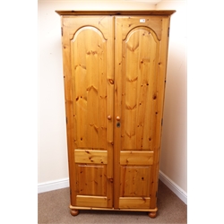  Solid pine double wardrobe,, projecting cornice, two doors, turned supports (W93cm, H191cm, D57cm) a matching six chest, six drawers, turned supports (W129cm, H77cm, D46cm) with dressing mirror, a bedside chest, single drawer and single headboard (5)  