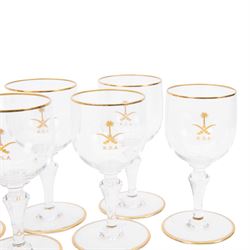 Baccarat decanter, six wine glass and six port glasses,  all with a gilt band to the rim and foot and motif for Kingdom of Saudi Arabia